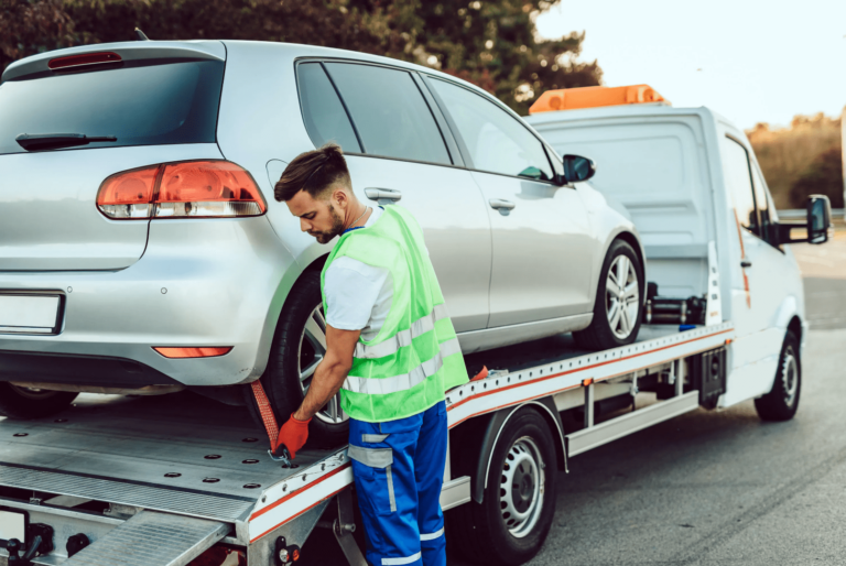 Recovery truck taking damaged car