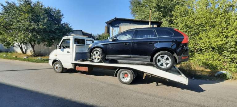 Recovery truck taking damaged vehicle