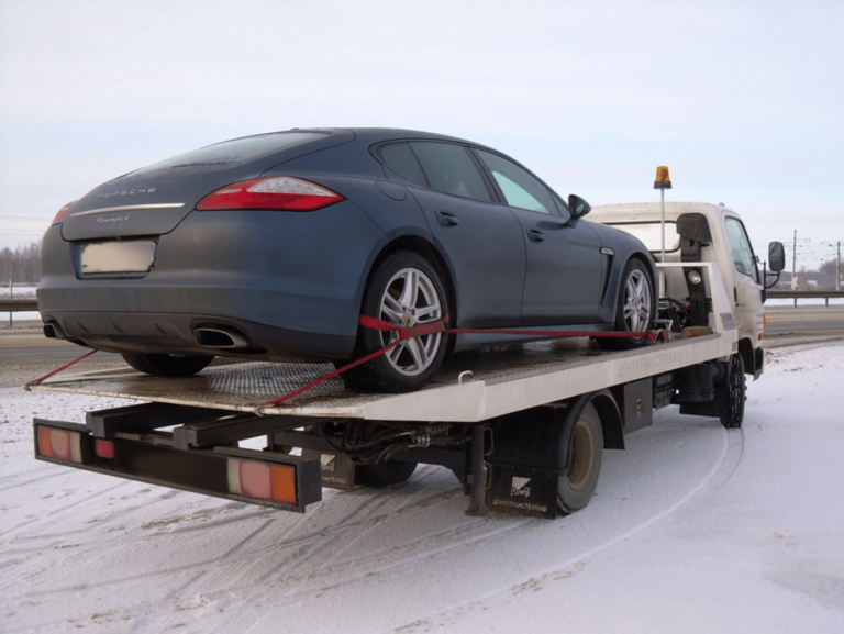 Recovery truck taking damaged vehicle